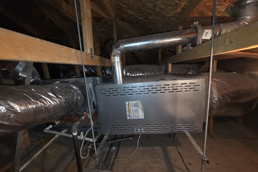 Gas furnace and ductwork installed in an attic