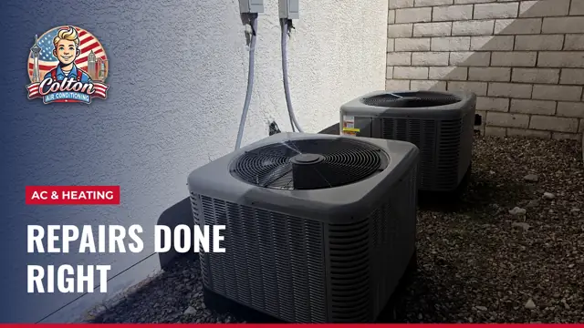 Two AC condensers on gravel beside a block wall